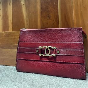 Burgundy purse or wallet really big in the inside has a lot of space